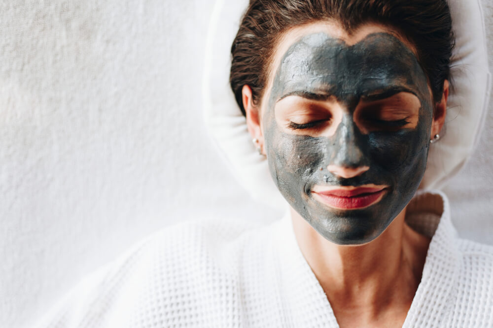 Woman with charcoal mask