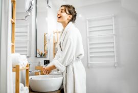 Woman at sink in bathroom