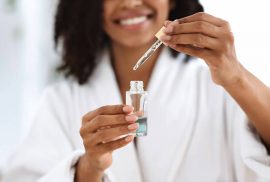 Woman using skin serum - skincare routine