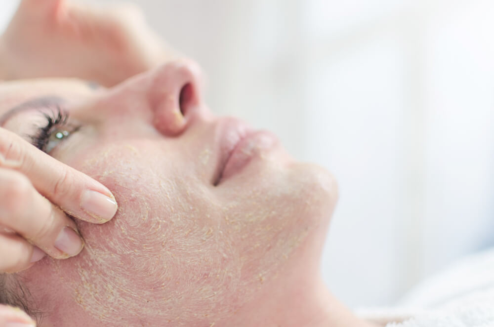 Woman having face treatment