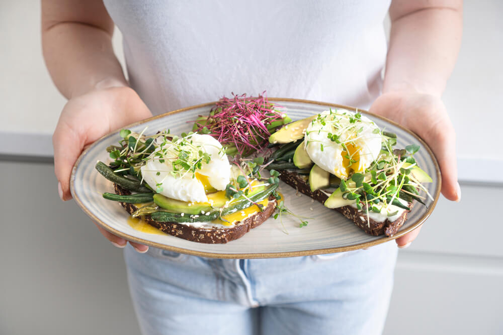 Microgreens and other food on plate