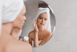 Woman applying face cream