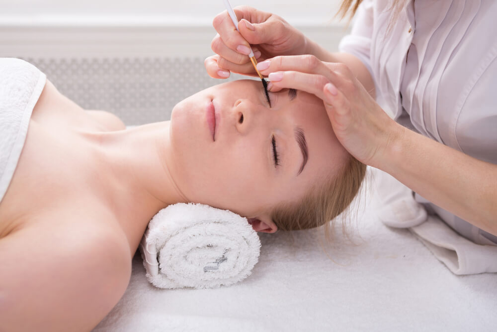 Woman having lashes tinted