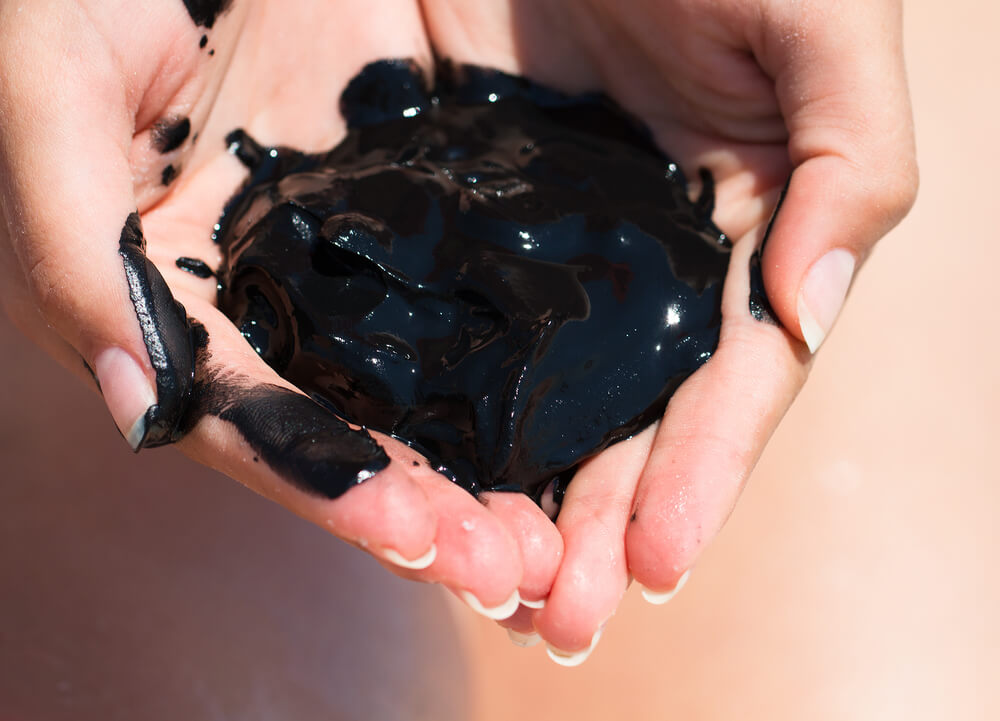 Dead Sea mud in hands