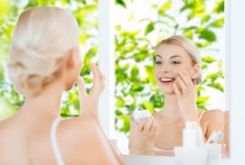 Woman applying skincare for spring