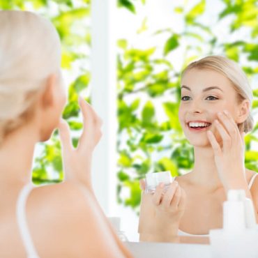 Woman applying skincare for spring