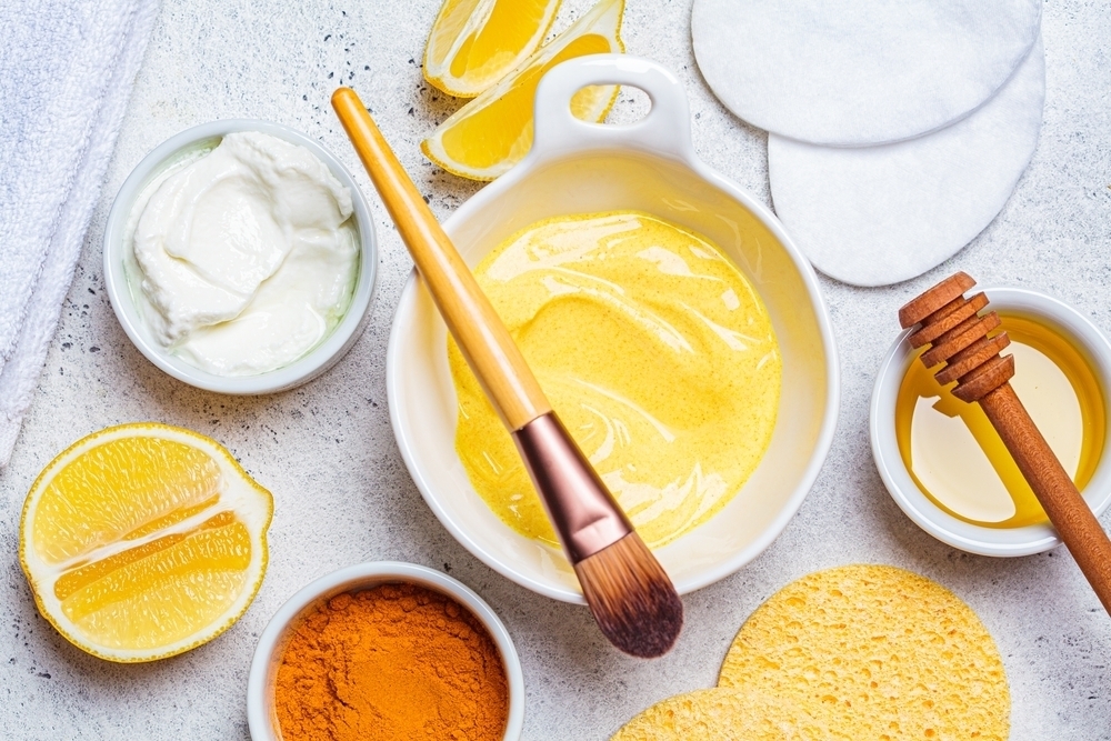 Turmeric face mask ingredients in bowls - skin care trends