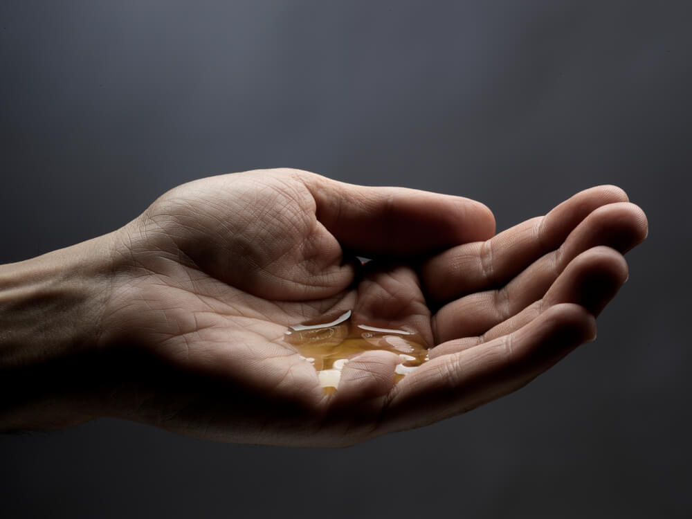 Vitamin E beard oil in hand