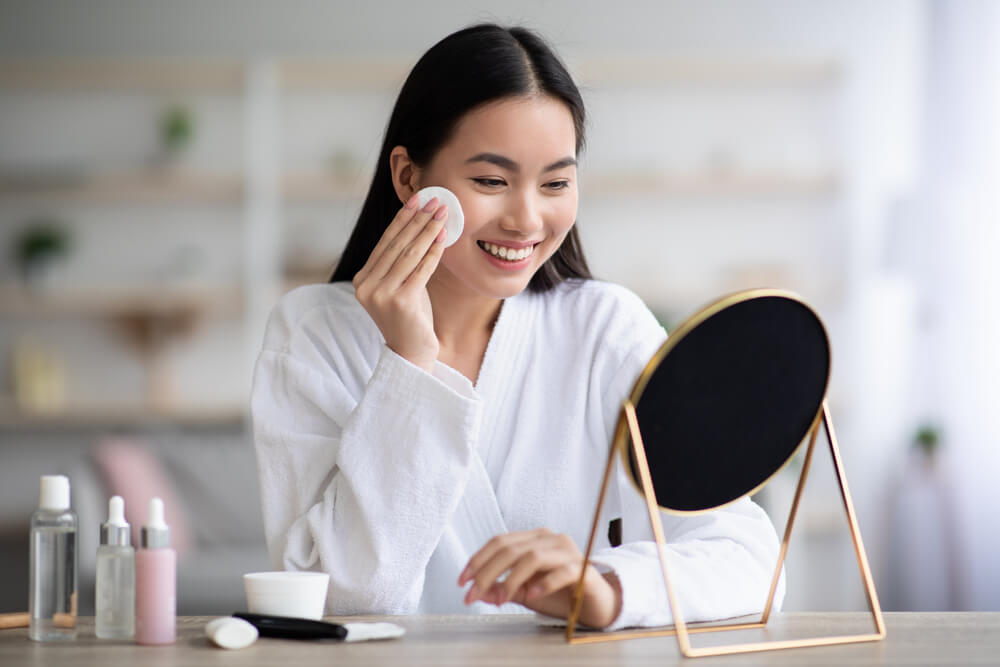 Woman applying toner