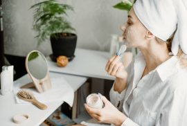 Woman applying face mask - Winter Skincare Routine