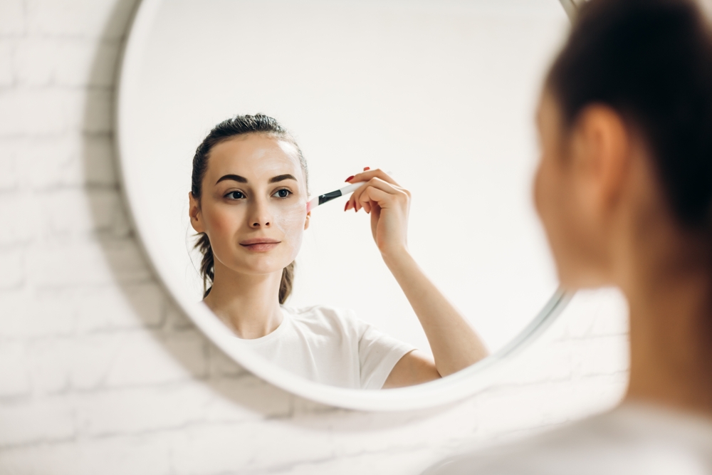 Woman applying makeup