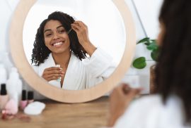 Woman applying face serum