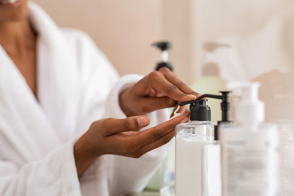 woman dispensing lotion