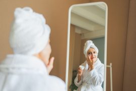 woman bathrobe skincare