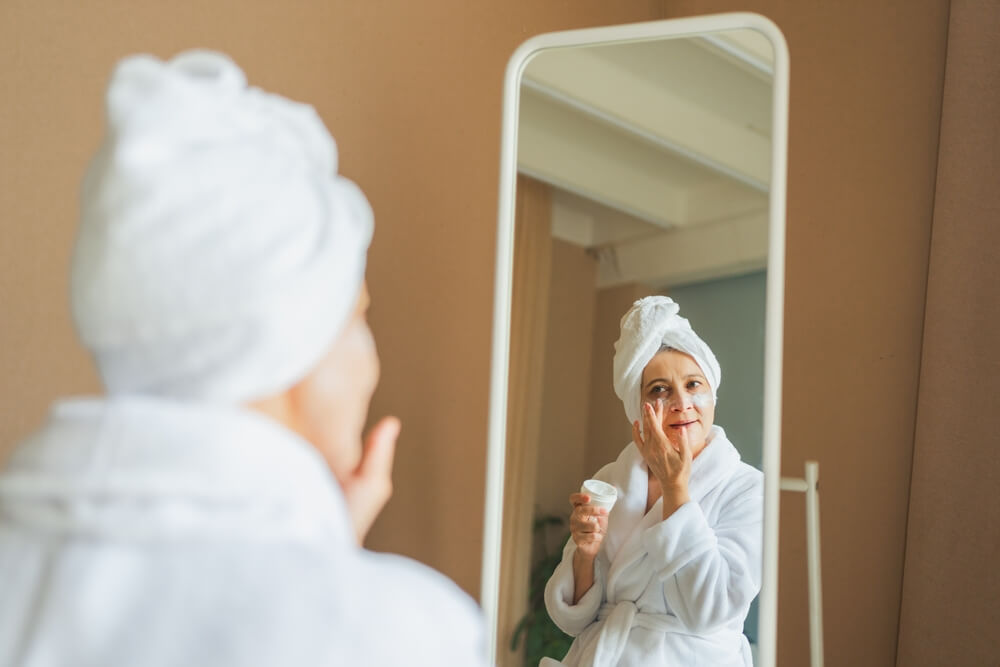 woman bathrobe skincare