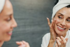 woman layering skincare