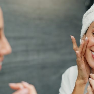 woman layering skincare