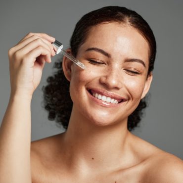 woman applying serum