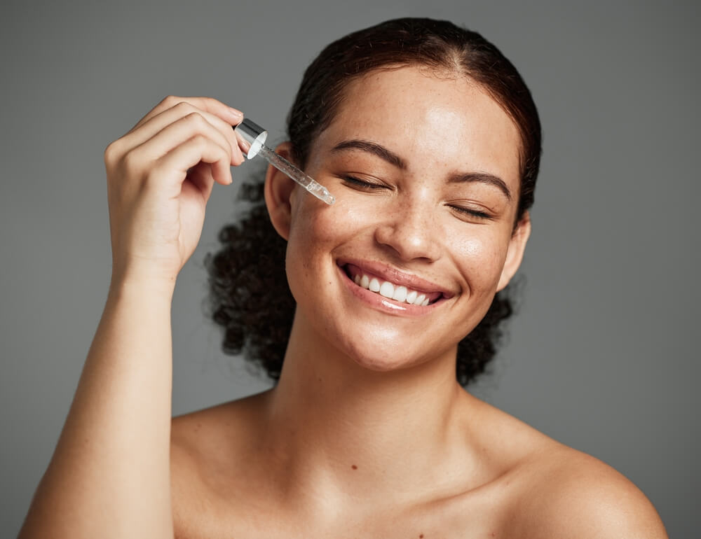 woman applying serum