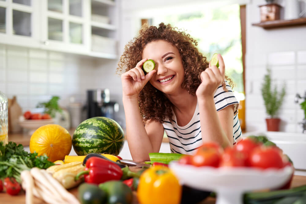 woman in kitchen with groceries